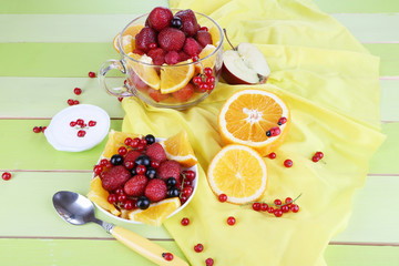Useful fruit salad in glass cup and bowl