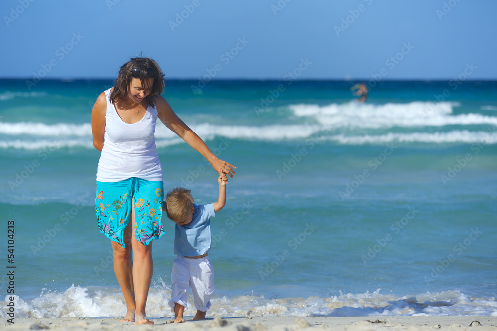 Wall mural mother and son on the beach