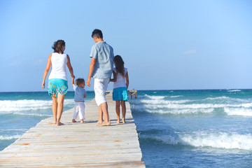 Family on wooden jetty.