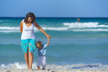 Fototapeta premium Mother and son on the beach