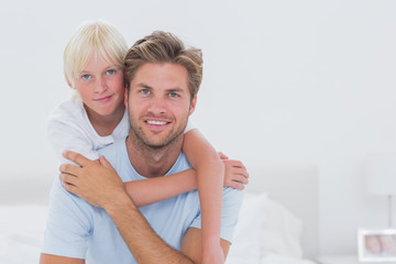 Portrait of a handsome father with son