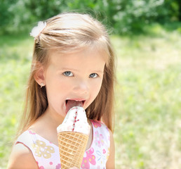 Beautiful little girl eating ice cream