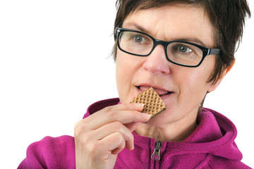 Woman eating biscuit