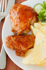 fried chicken with potato chips on plate