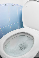 water flushing in toilet bowl or sink or WC