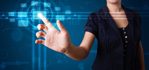 Woman pressing high tech type of modern buttons