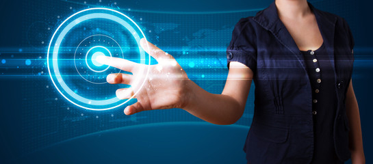 Woman pressing high tech type of modern buttons
