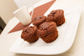 Chocolate Muffins with a cup of coffee