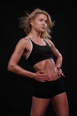 fitness young woman on black background