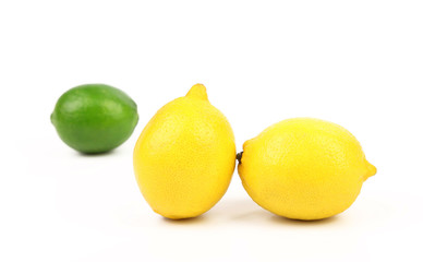 Fresh lime, two lemons isolated on white