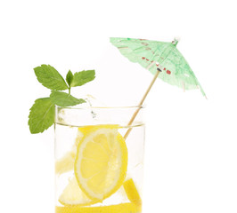 Full glass of water with lemon and mint