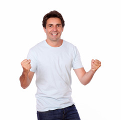 Cheerful male celebrating victory while standing