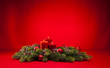Red advent wreath with candles