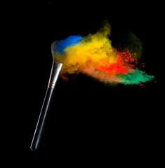 Colored powder with brush, isolated on black background