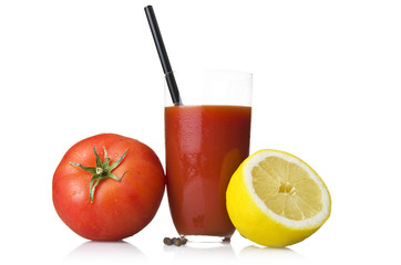 Glass with Tomato juice close up on white