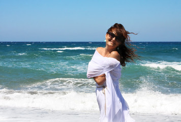 Fototapeta na wymiar The beautiful girl in the sea in white