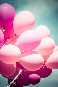 pink balloons and blue sky background