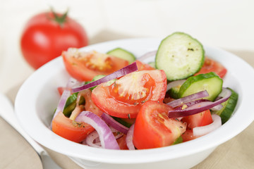 served plate with mix salad from tomatoes and cucumbers