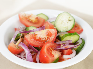 served plate with mix salad from tomatoes and cucumbers