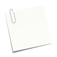 White sticky note clipped with a paperclip