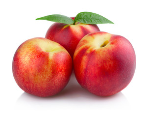 Three ripe peach (nectarine) fruits isolated