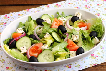 Greek salad with tomato, cucumber, onion, cheese and olives