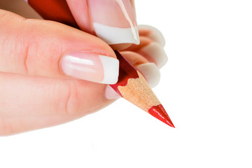 Hand mit Rotstift