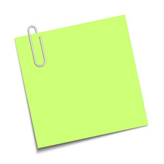 Green sticky note clipped with a paperclip