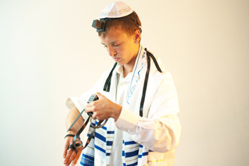 Young Jewish man does  prayers .