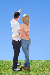 Portrait Of Couple Looking At Sky