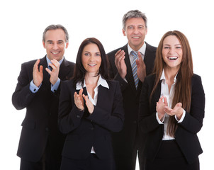 Portrait Of Happy Businesspeople Clapping