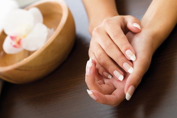 Woman's hands lying on the table