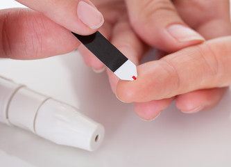 Close-up Of Hand Checking Diabetes