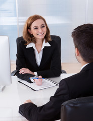 Two businesspeople talking with each other