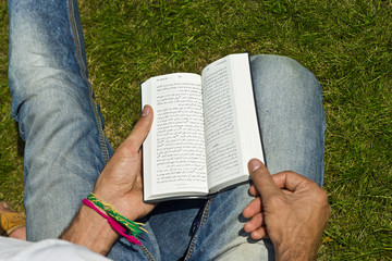 Young Man Ex-muslim Reading Bible Outside