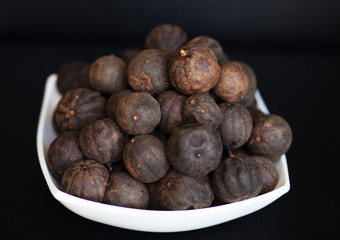 Obraz premium Black dried Lime or Lemon. Spice used in Middle Eastern dishes