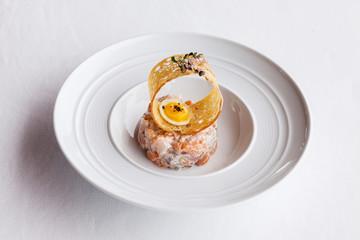 Fresh  salmon salad with tomato,caviar and crispy.