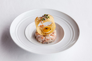 Fresh  salmon salad with tomato,caviar and crispy.