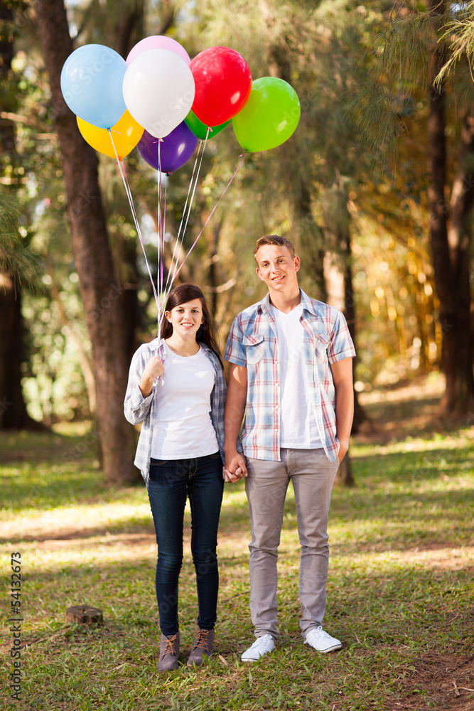 Wall mural young teen couple in forest