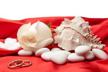  wedding rings and  favors on elegant  fabric