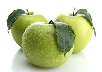 Ripe green apples with leaves  isolated on white