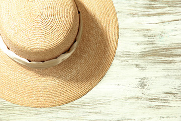 Fototapeta na wymiar Beautiful summer hat on wooden background