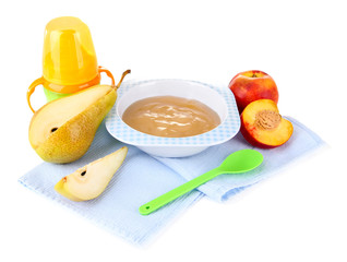 Tasty baby fruit puree and baby bottle isolated on white