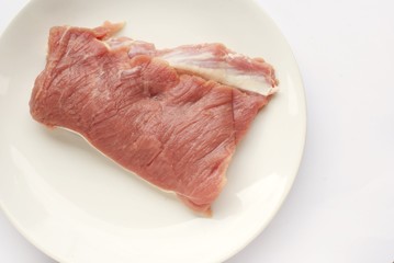 slices of raw pork  preparing to cook
