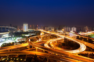 night view of the bridge and city in shanghai china. - obrazy, fototapety, plakaty