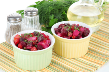 Beet salad in bowls on table close-up