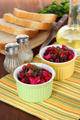 Beet salad in bowls on table close-up