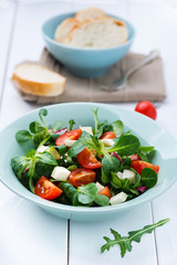 salad of lamb's lettuce, mozzarella cheese and tomatoes
