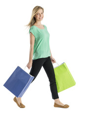 Beautiful Woman Smiling While Walking With Shopping Bags