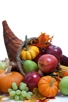 An overflowing cornucopia on a white background